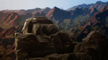 Panoramic view of a stunning mountain range with rocky terrain in the foreground. Perfect for adventure seekers looking for an extreme hiking experience in the heart of untouched wilderness. video