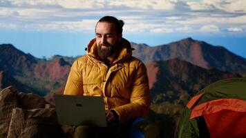Young entrepreneur always connected to internet to do some tasks, workaholic person enjoying high speed strong signal and technology dependency. Hiker with an addiction. Camera B. video