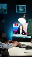 Vertical Financial advisor examines cryptocurrency trade market from his loft workstation, looks at online global exchange statistics on desktop. Guy studying stock analysis to secure capital funds. Camera A. video