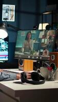 Vertical African american remote worker attending a web meeting call in a living room. Smiling black man engages in virtual communication to discuss about executive matters from home office. Camera A. video