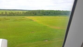A view of a field from an airplane window video