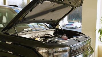 SUV with open hood for maintenance in service center video
