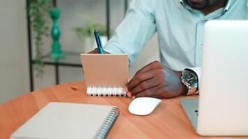 Hands of man writes notes in notepad. video