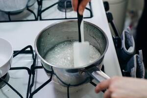Boiling sugar mixture. Wet Caramelization. Making Golden Syrup Series photo