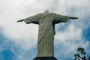 The Christ the Redeemer statue a top the Corcovado Mountain in Rio de Janeiro, Brazil. photo