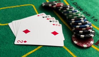 A popular and exciting poker game with a winning combination. Playing cards and chips on a table in a poker club. Advertising space. photo