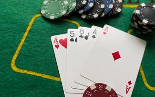 A popular and exciting poker game with a winning combination. Playing cards and chips on a table in a poker club. Advertising space. photo