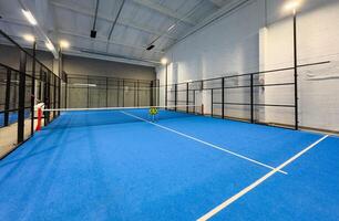 Padel court with lines and net indoor photo