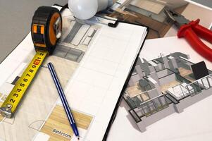 Architectural engineering design plan drawing on the table. Architect's work on table in studio. Construction design and plan photo