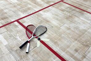 Squash Racket and Ball Sport Played by Two or Four Players. Court Floor and the Rockets photo