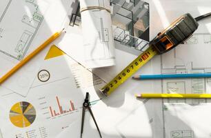 Housing blueprint working desk of architect engineer, only object shot. photo