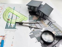 Architectural engineering design plan drawing on the table. Architect's work on table in studio. Construction design and plan photo