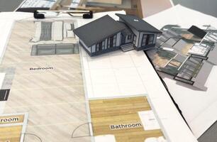 Architectural model on desk , drawing technical tools and blueprints. Architecture, building, construction and real estate business. photo