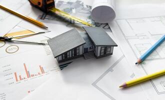 Housing blueprint working desk of architect engineer, only object shot. photo