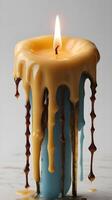 A close-up view of melted and solidified candle wax forming smooth, organic shapes. photo