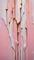A close image of dripping, glossy paint creating fluid, organic patterns. photo