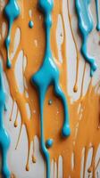 A high-definition view of glossy paint dripping and forming natural lines. photo