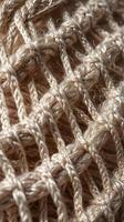 A macro view showing the texture of interwoven fabric threads. photo