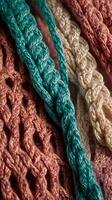 A macro of interwoven threads in a knitted fabric with visible loops. photo