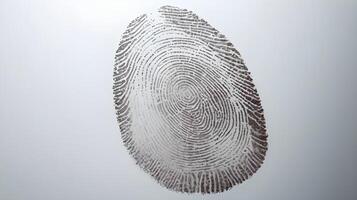 A zoomed-in view of a human fingerprint impression on polished glass. photo