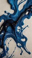 A detailed shot of ink dispersing in soft patterns on textured paper. photo