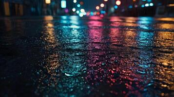 A detailed shot of colorful neon reflections shimmering on a wet surface. photo