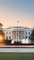 A warm morning glow wraps around the White House, with a gradient sky serving as an ideal background for Presidents Day text. photo