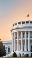 The White House is bathed in the warm glow of the morning sun, with a gradient sky, creating a perfect backdrop for Presidents Day text. photo