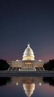 A mesmerizing night shot of the U.S. Capitol, illuminated in warm tones, with a blurred foreground for text placement. photo