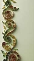 Green and brown quilled paper spirals shaped like vines and leaves, with a space in the center for copy. photo
