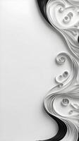 Paper quilling strips in black and white form flowing wave-like curves, leaving an empty space for text. photo