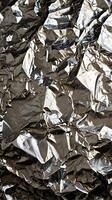A tight macro focusing on the complex texture of crumpled foil. photo