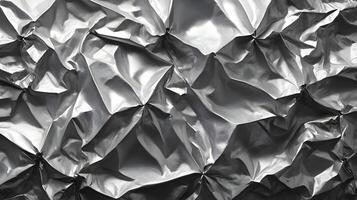 A macro image revealing the complex surface of crumpled foil. photo