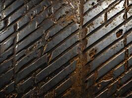 A textured macro of industrial metal with scratches and dirt marks. photo