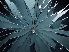 A magnified view of broken glass with sharp, detailed crack patterns. photo
