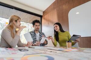 Diverse design team discussing concepts and sharing feedback in modern workspace. photo