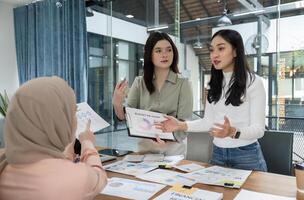 Dynamic discussion among office workers about financial strategies and project planning in a collaborative environment. photo