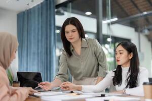 Office team discussing financial strategies in a collaborative meeting. photo
