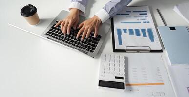 Financial professionals collaborating on tax reports and analysis in a modern office setting. photo