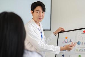 Professional worker presenting financial data in a meeting, showcasing tax strategies and analysis. photo