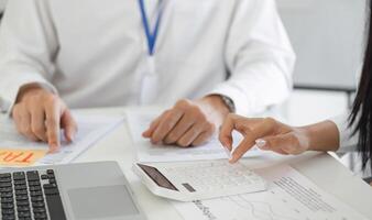 Calculating taxes with a calculator and financial documents photo