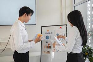 Colleagues analyzing financial reports and tax data in a collaborative workspace photo