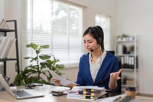 Engaged accountant discussing financial matters while reviewing documents. photo