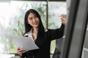 Smiling accountant presenting financial insights and tax strategies in a modern workspace. photo