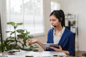Engaged accountant discussing financial matters while reviewing documents in a modern office. photo