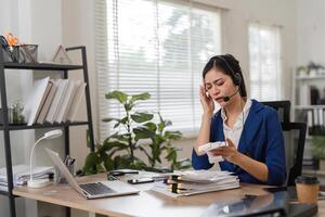 Stressed accountant dealing with financial issues during a call, highlighting challenges in tax preparation. photo