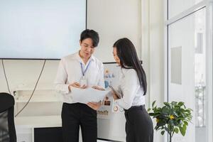 Collaborative analysis of financial strategies and tax documents in a professional setting photo