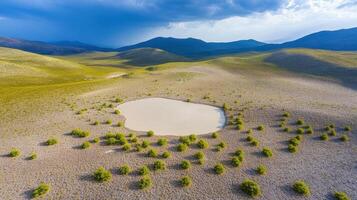 Aerial view of serene desert oasis with surreal white pond and rolling hills photo