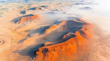 Aerial view of scenic orange sand dunes in breathtaking desert landscape photo