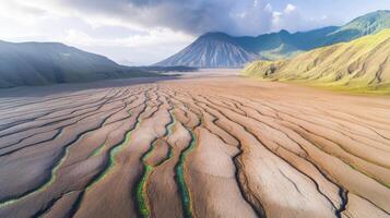 Aerial view of arid landscape with striking mountain and dry riverbed patterns photo